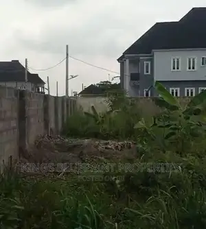 100 by 100 Fenced and Gated at Opete Close to Road.