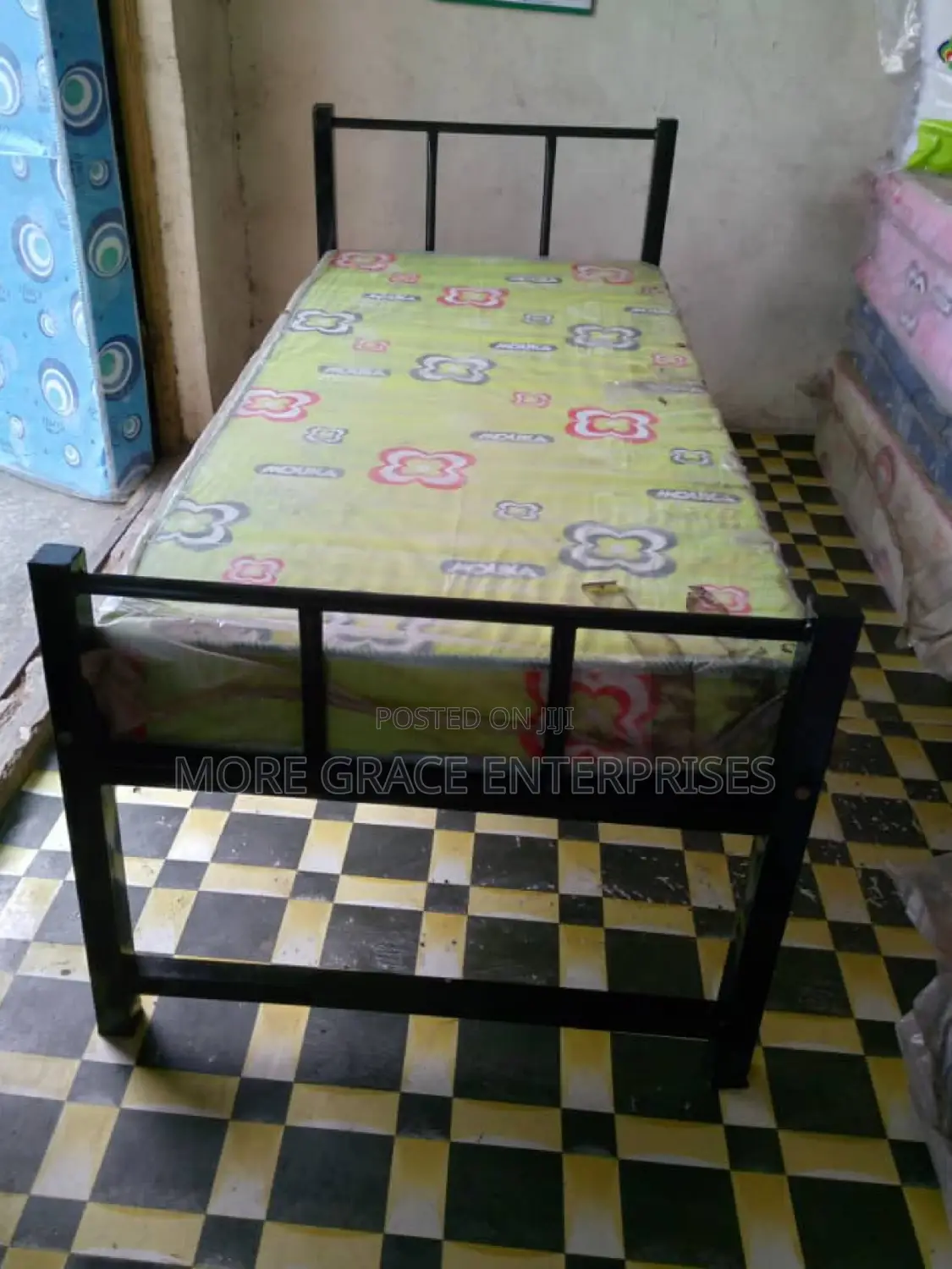 Durable Single Metal Bed Frame for Security Rooms.