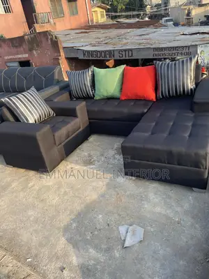 A Standard L Shape Sofa With Additional Single