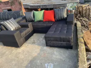 A Standard L Shape Sofa With Additional Single
