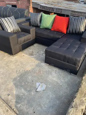 A Standard L Shape Sofa With Additional Single