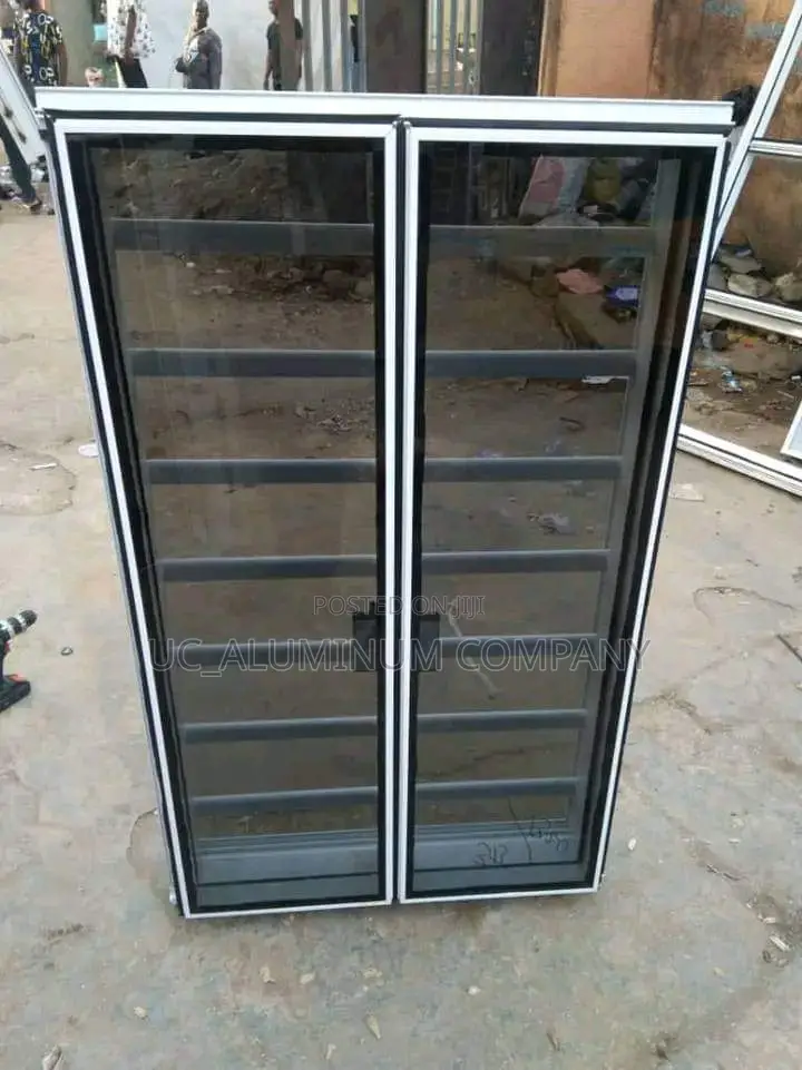 White Frameless Window With Burglary and Net