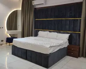 A Classic Bedframe With Two Side Cupboard and Dressing Table