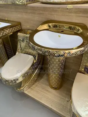 Luxury Gold and White Water Closet With Big Basin