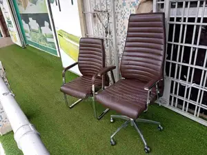 Brown Swivel And Leather Visitors Chair