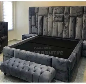 A Padded Bed Attached With a Footrest