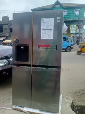 LG Side by Side Refrigerator With Ice Maker and Dispenser.