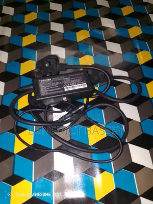 Photo - Laptop Adapter With Power Cord.