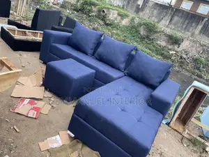 A 6 Seater Sofa With Center Puff
