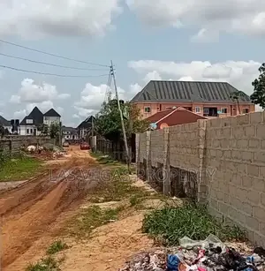 2plots of Land Fenced Round With Gate at (AREA UA)