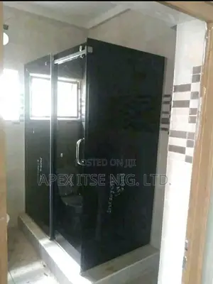 Dark Grey Glass Bathroom Cubicle.