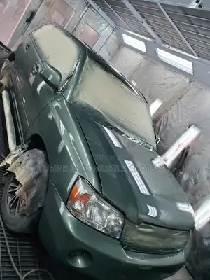 Panel Beating and Oven Baking of Highlander