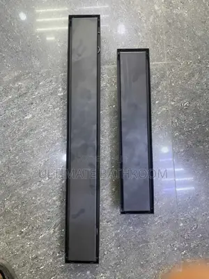 Matte Black Tiles In Front Bathroom Floor Drain
