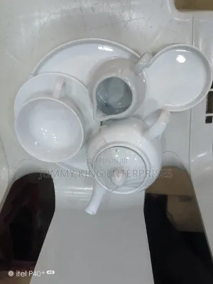 Sets of Tea Cups, Saucers and Kettle