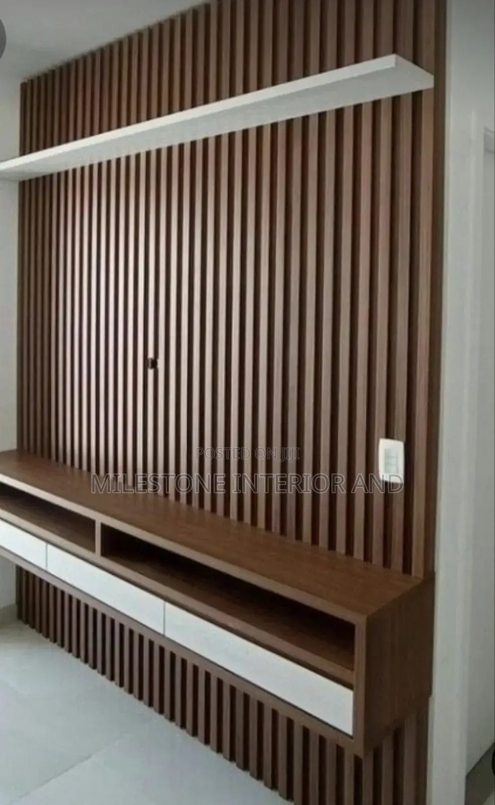 Wall-Clauded Tv Panel With Multi Coloured Suspended Console