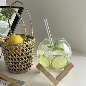 Spherical Borosilicate Glass Cup on a Wooden Stand