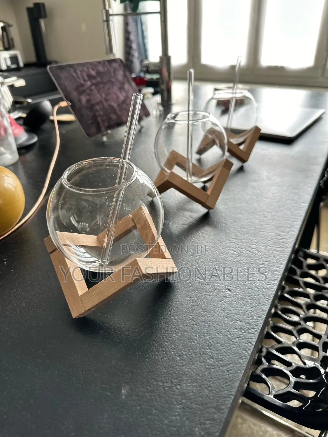 Spherical Borosilicate Glass Cup on a Wooden Stand
