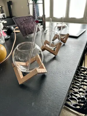 Spherical Borosilicate Glass Cup on a Wooden Stand