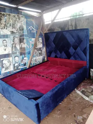 4.5 Ft Upholstery Bedframe With a Side Drawer.