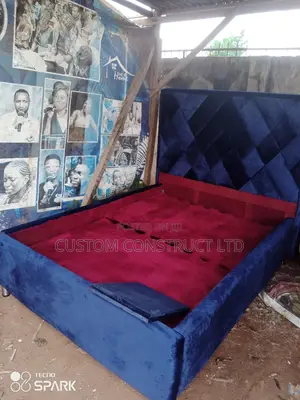 4.5 Ft Upholstery Bedframe With a Side Drawer.