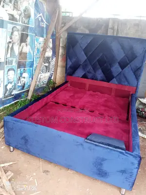 4.5 Ft Upholstery Bedframe With a Side Drawer.