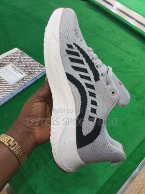 Big Size Sports Shoes for a Giant Leg.