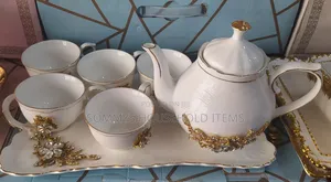 Fashionable 6pcs Teacups , Kettle Pot and Tray .