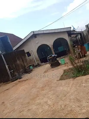 Half Plot With 2 Nos of 3 Bedrooflat at Kpako Bustop Iguando