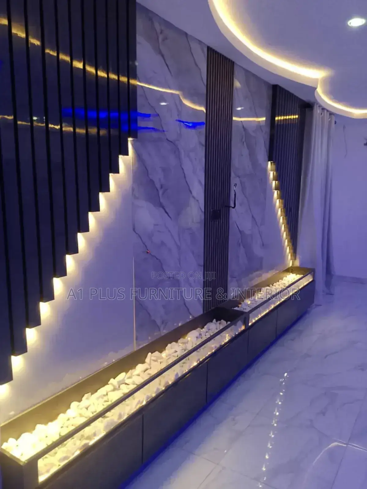Wall Cladding With Spotlights and Stone Accents