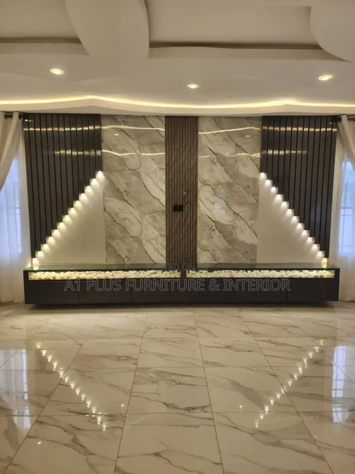 Wall Cladding With Spotlights and Stone Accents
