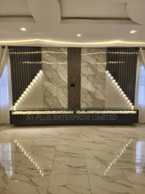 Wall Cladding With Spotlights and Stone Accents