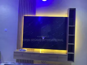 Tv Console With One Side Panel and Shelf for Artwork Storage