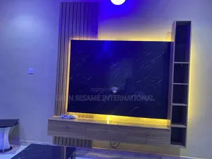 Tv Console With One Side Panel and Shelf for Artwork Storage