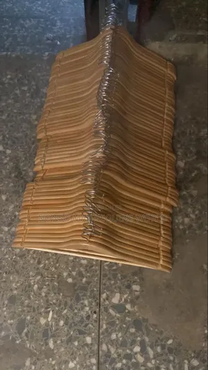Packs of Neat Wooden Clothes Hangers