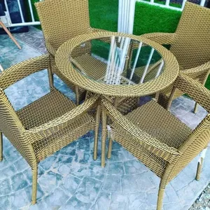Round Rattan Table With Four Rattan Chairs