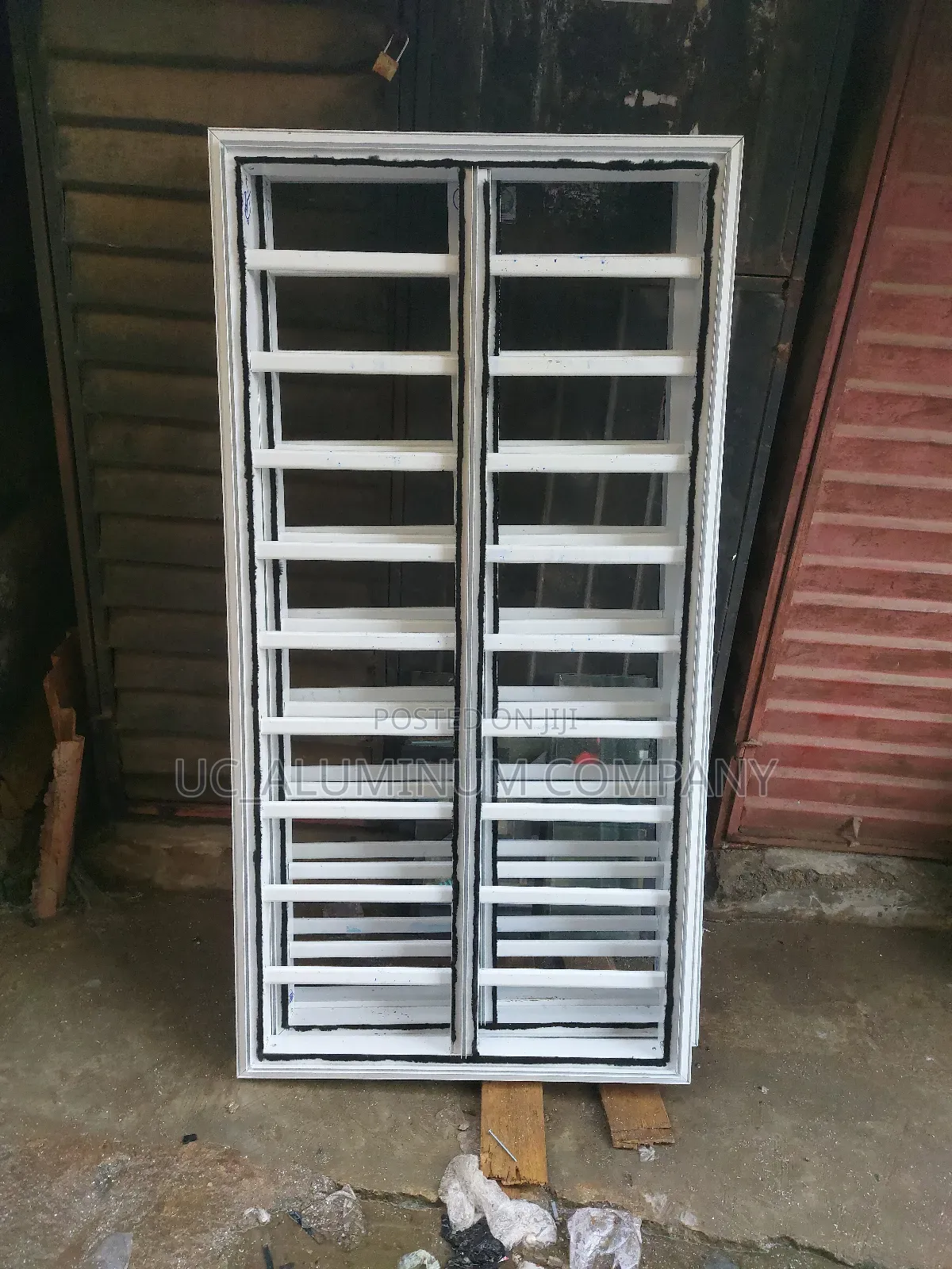 White Frameless Window With Grey Reflective Glass