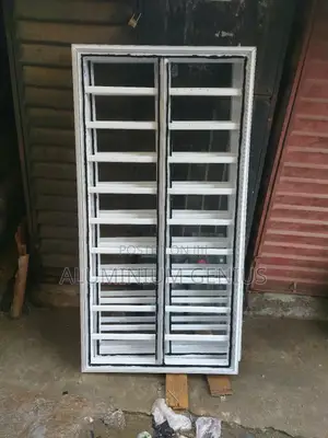 White Frameless Window With Grey Reflective Glass