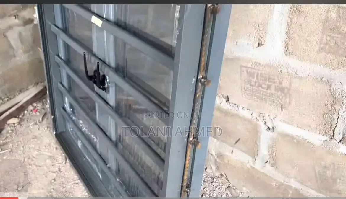Grey Casement Window With Burglary and Net