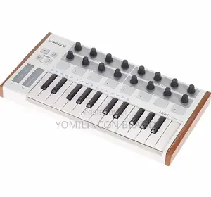 Photo - Worlde 25-Key USB MIDI Drum Pad and Keyboard Controller