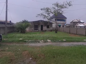 A Plot of Land With an Uncompleted Building on It