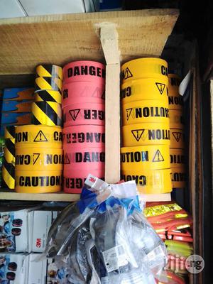 Caution Tapes And Wet Floor Signs