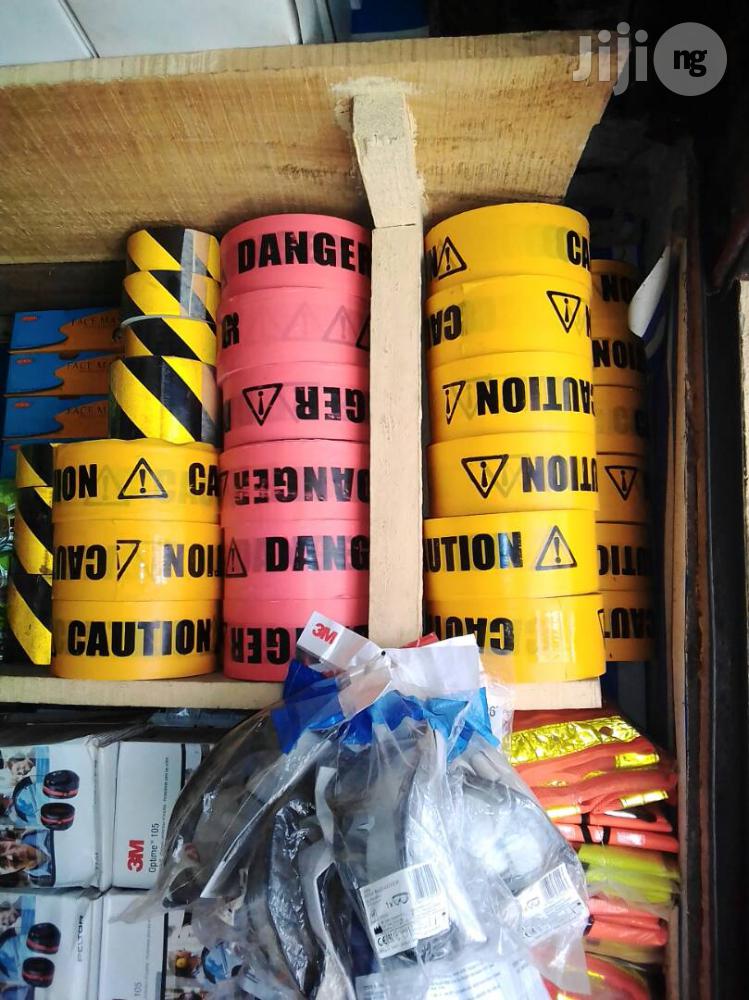Caution Tapes And Wet Floor Signs