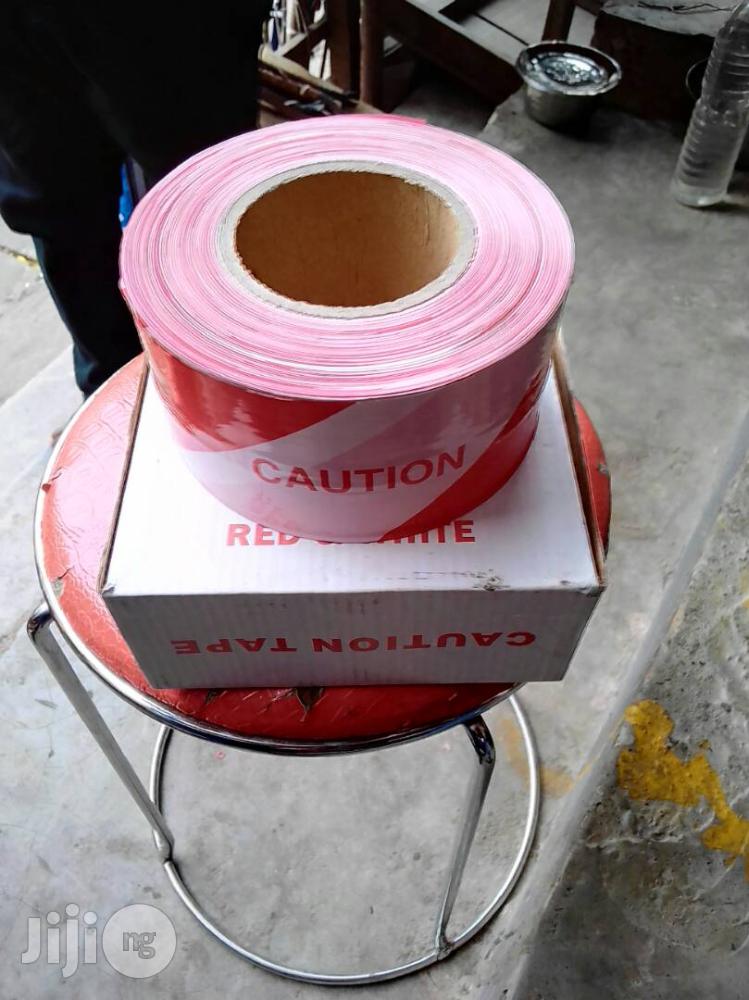 Caution Tapes And Wet Floor Signs