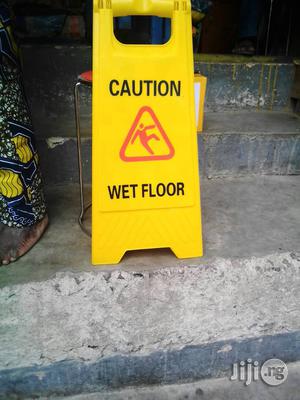 Caution Tapes And Wet Floor Signs