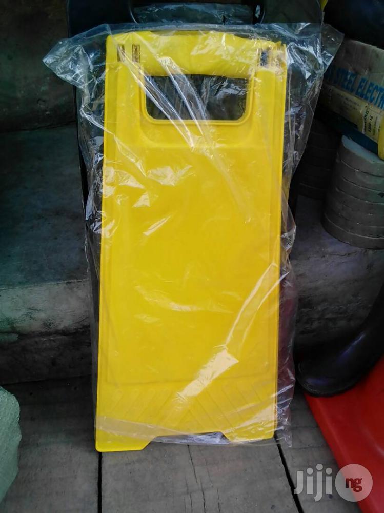 Caution Tapes And Wet Floor Signs