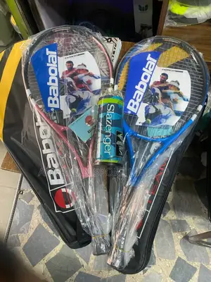 Two Lawn Tennis Rocket and Three Balls