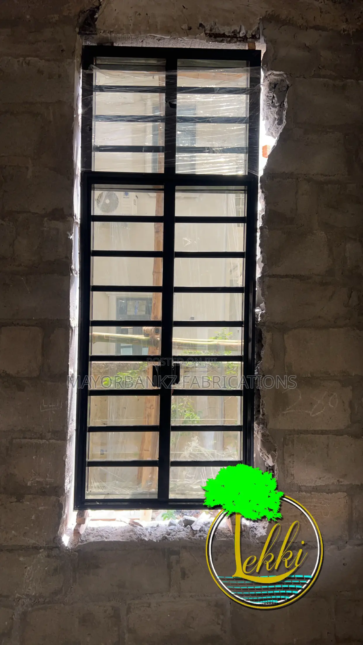 Frameless Window With Black Profile And Gray Glass