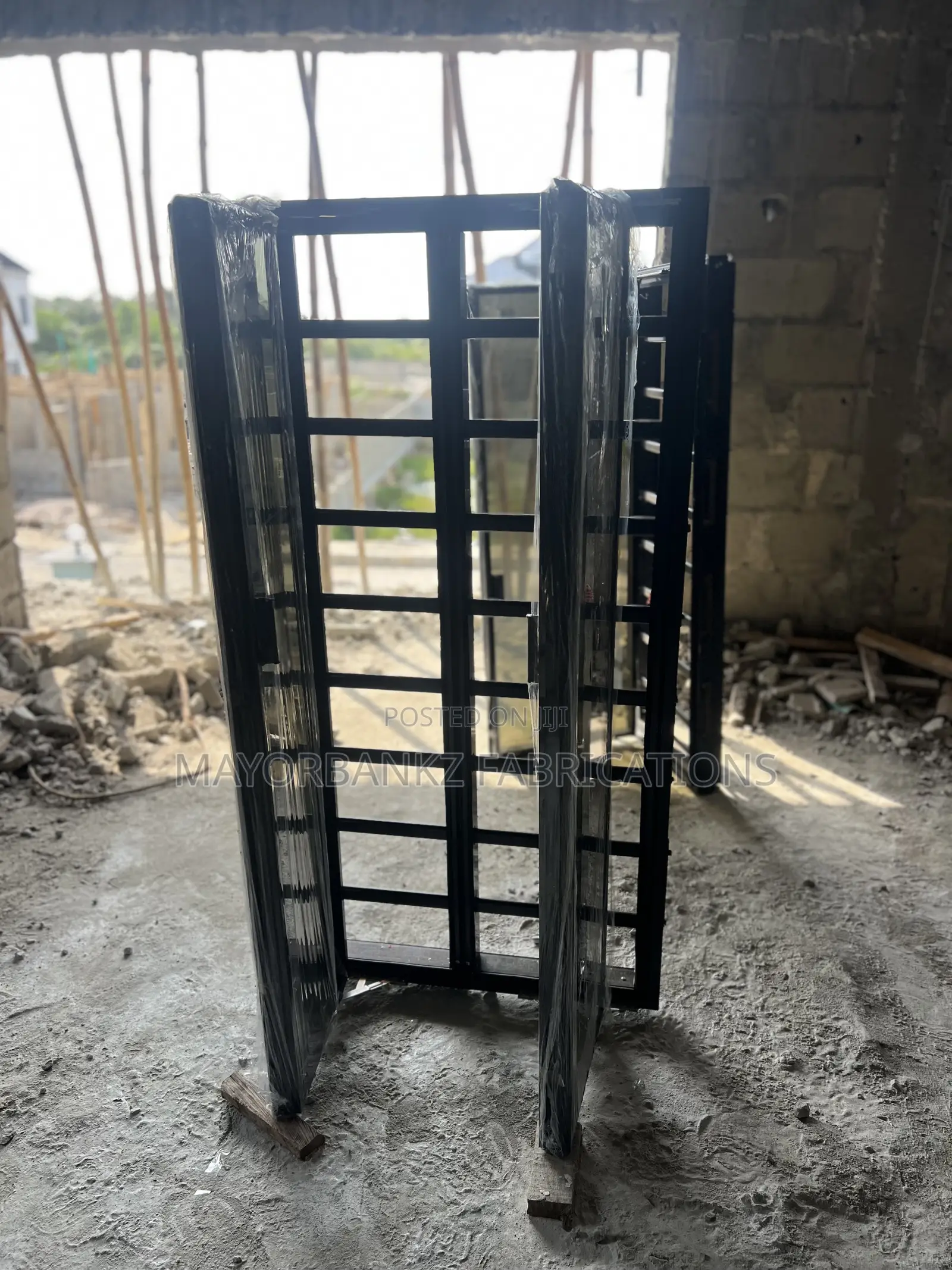 Frameless Window With Black Profile And Gray Glass