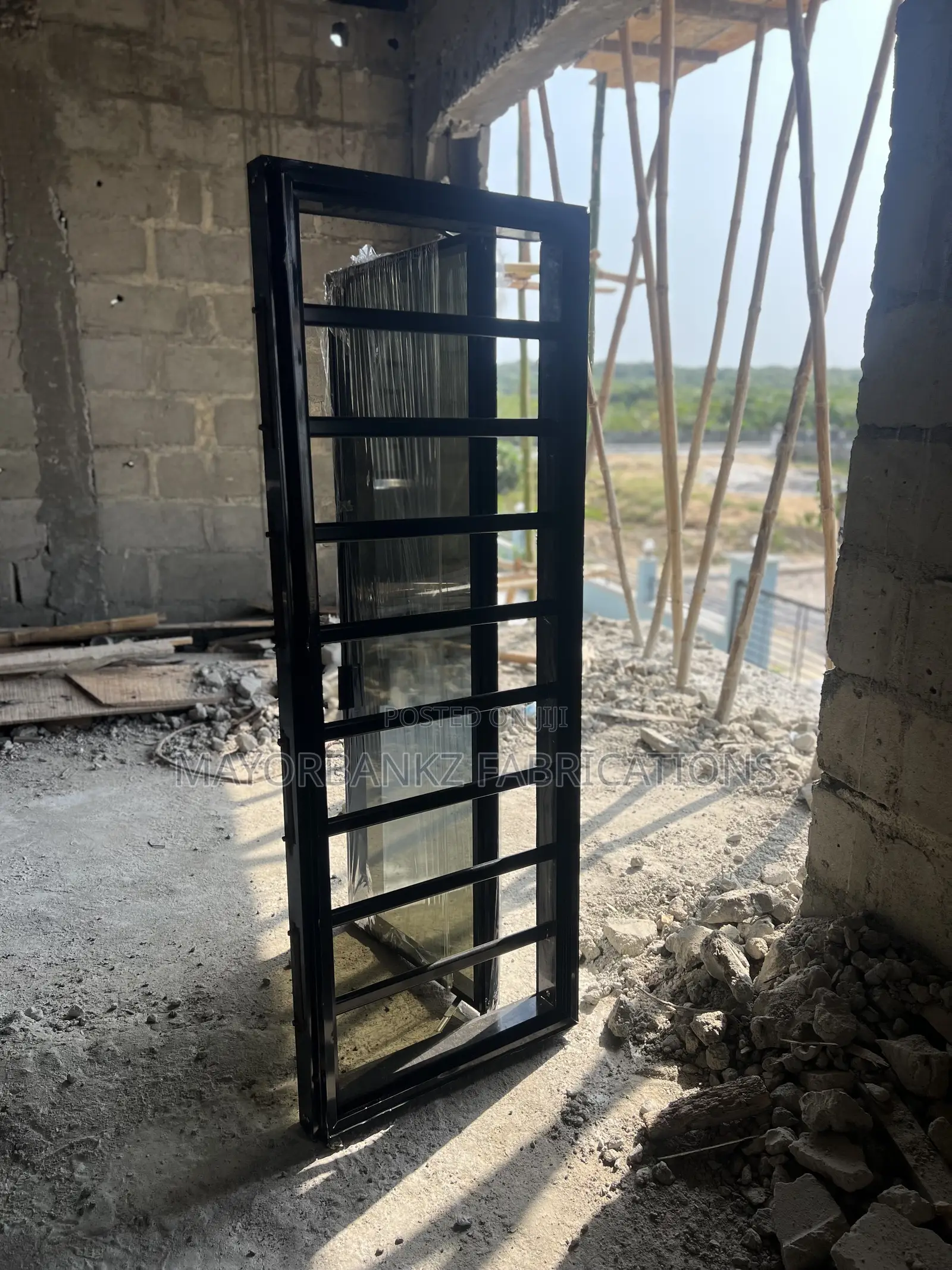 Frameless Window With Black Profile And Gray Glass
