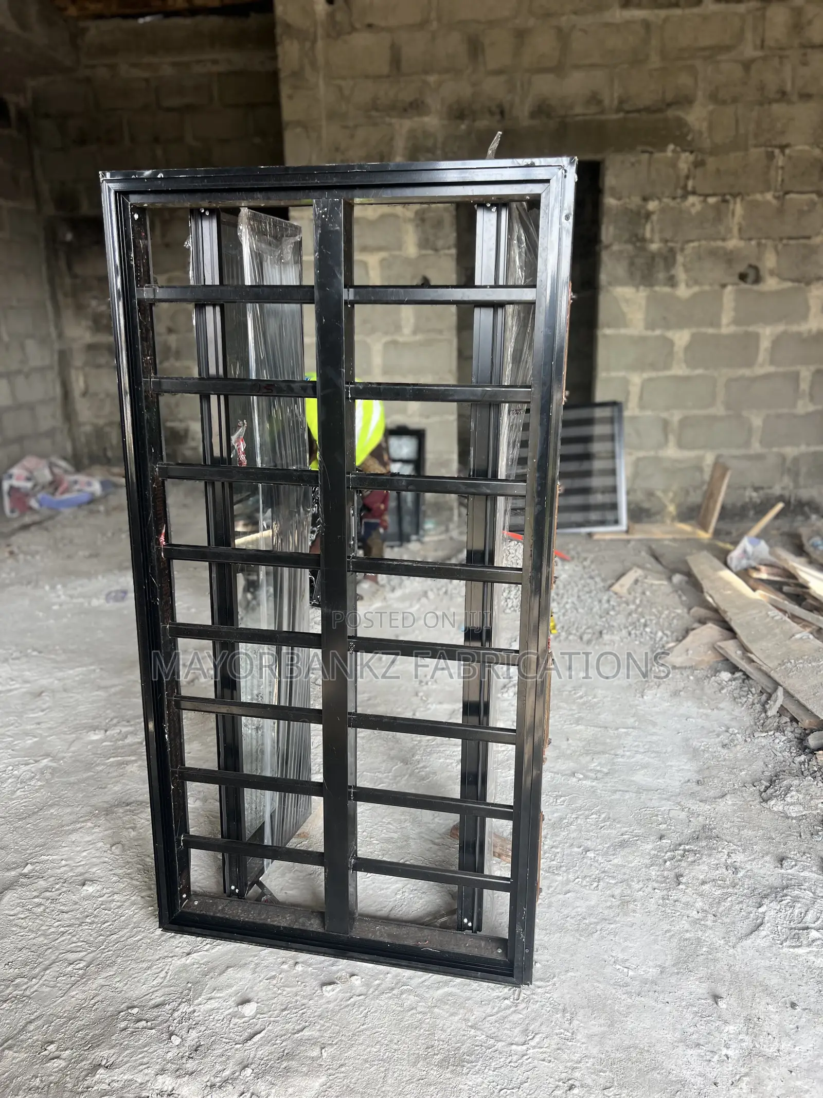 Frameless Window With Black Profile And Gray Glass